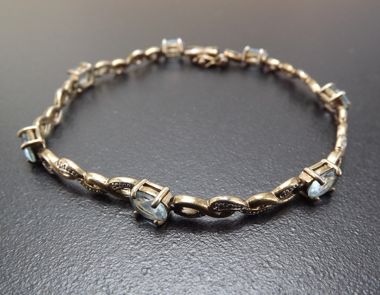 57 1166.jpg Vintage Sterling Silver Blue Topaz Tennis Bracelet – Solid .925 Line Bracelet 8″, 10.1 Grams, Clasp Needs Repair