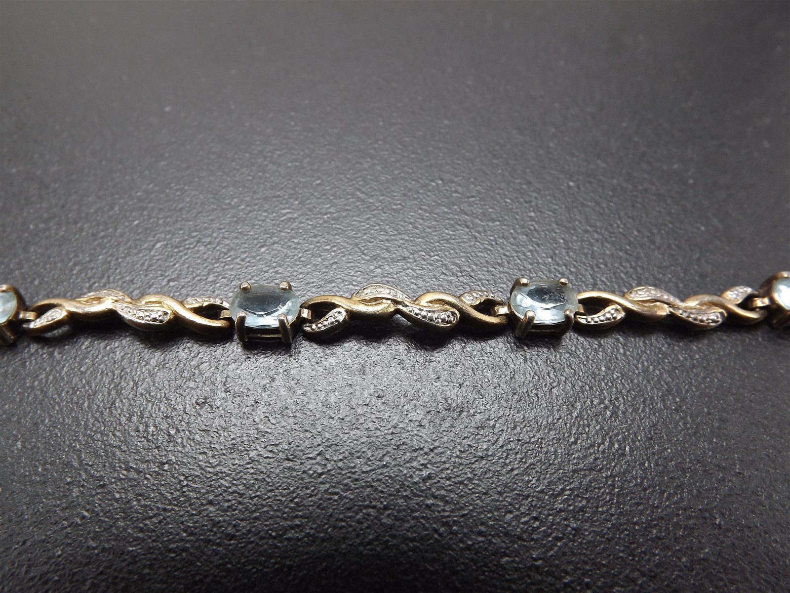 57 1172.jpg Vintage Sterling Silver Blue Topaz Tennis Bracelet – Solid .925 Line Bracelet 8″, 10.1 Grams, Clasp Needs Repair