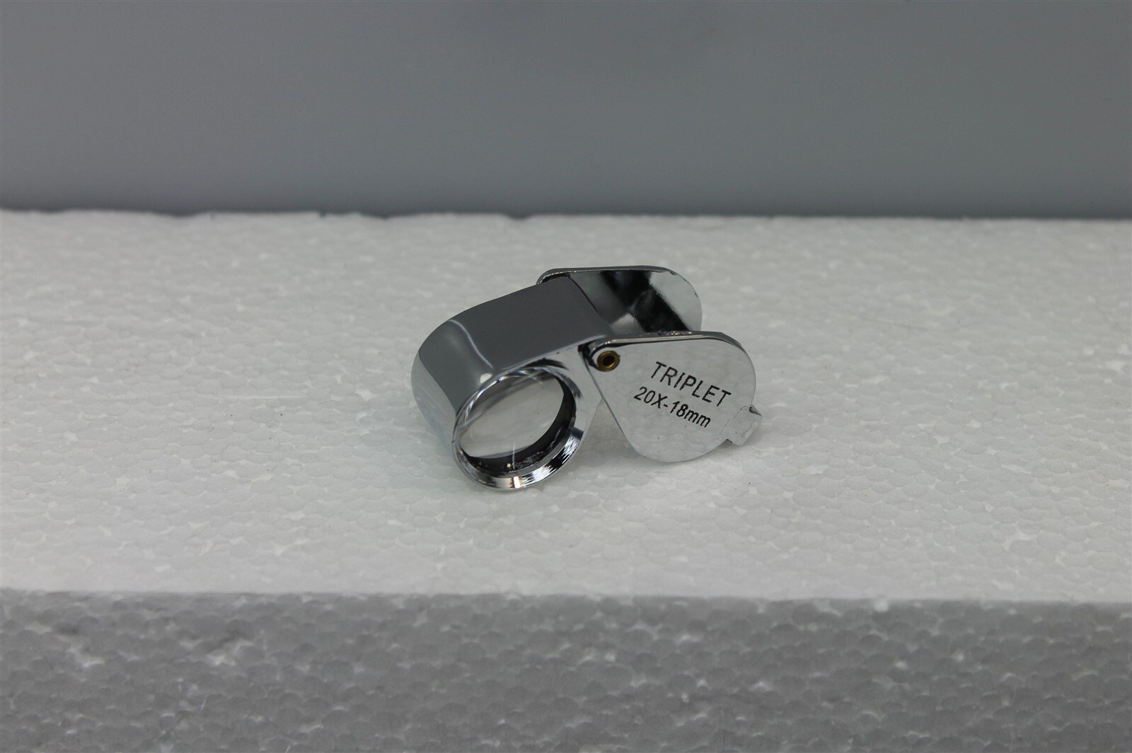 57 1173.jpg 10X Triplet Jewelers Loupe 21mm Chrome Round Body – Professional Gem and Diamond Magnifier with Pouch