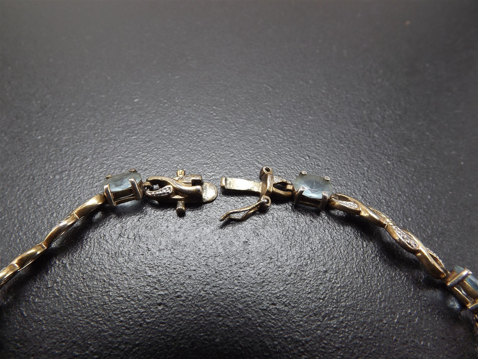 57 1178.jpg Vintage Sterling Silver Blue Topaz Tennis Bracelet – Solid .925 Line Bracelet 8″, 10.1 Grams, Clasp Needs Repair