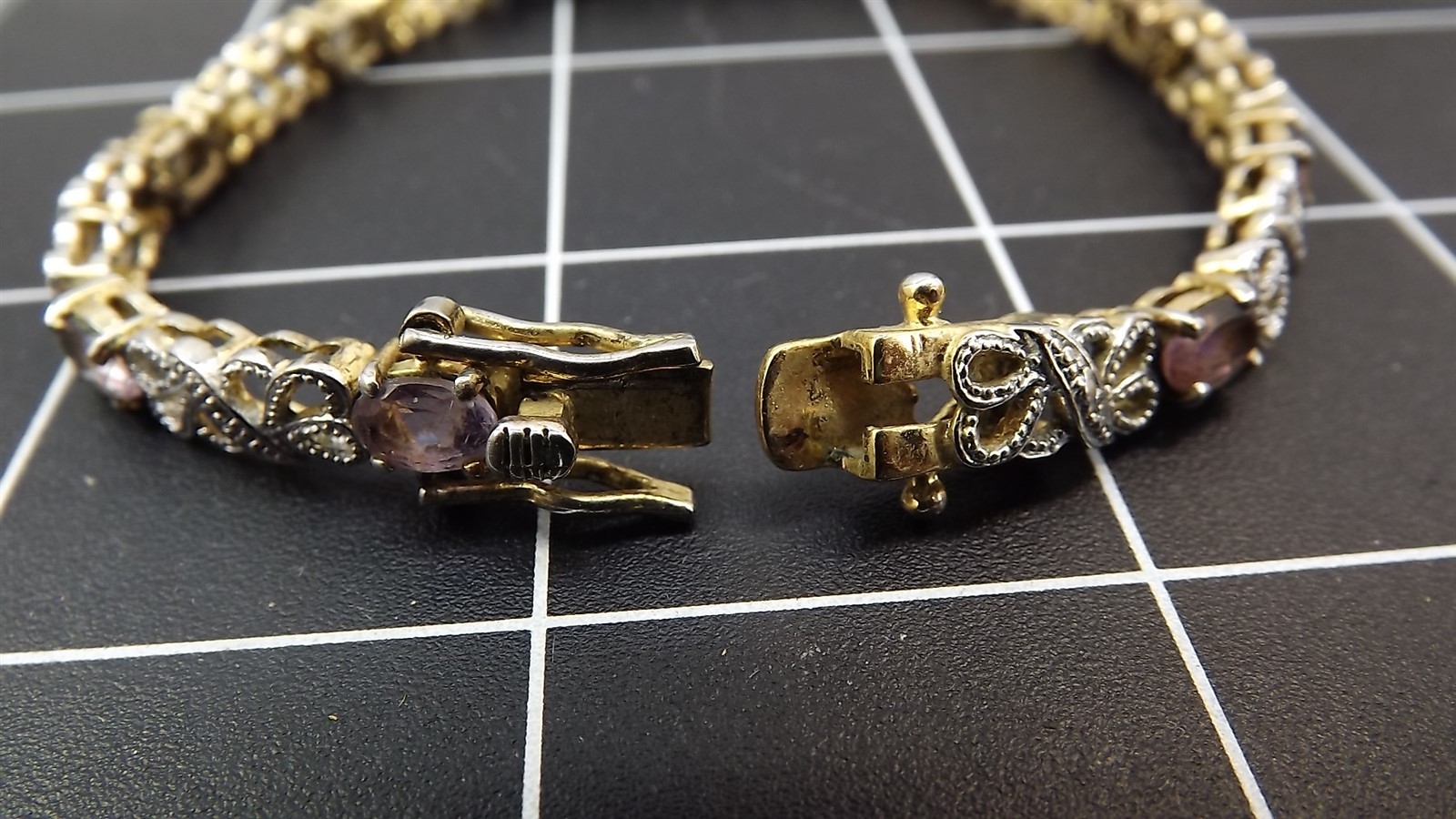 57 2351.jpg Gold Tone Purple Stone Tennis Bracelet 8″ – Marked 925 Line Bracelet with Purple Stones, 14.1 Grams