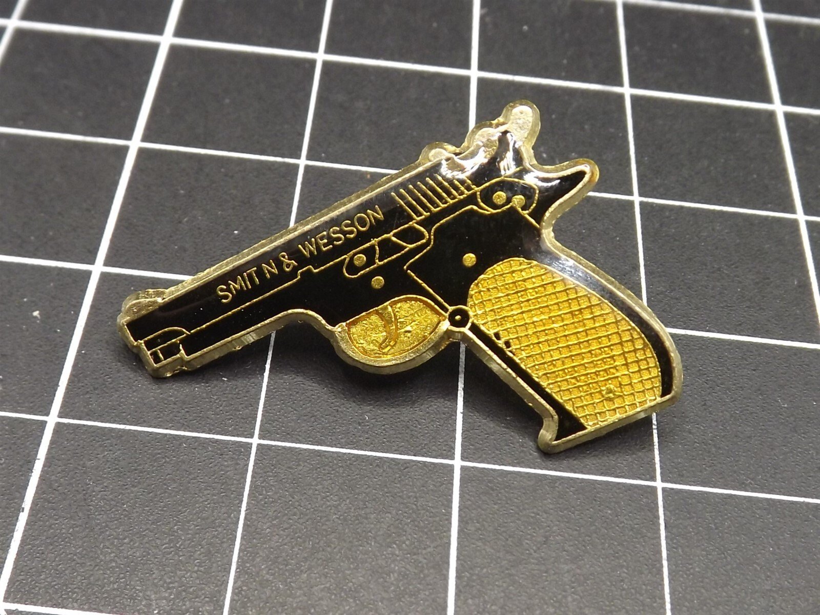 57 651.jpg Smith & Wesson 38 Caliber Pistol Lapel Pin – Black & Gold Enamel Revolver Hat Pin for Gun Collectors