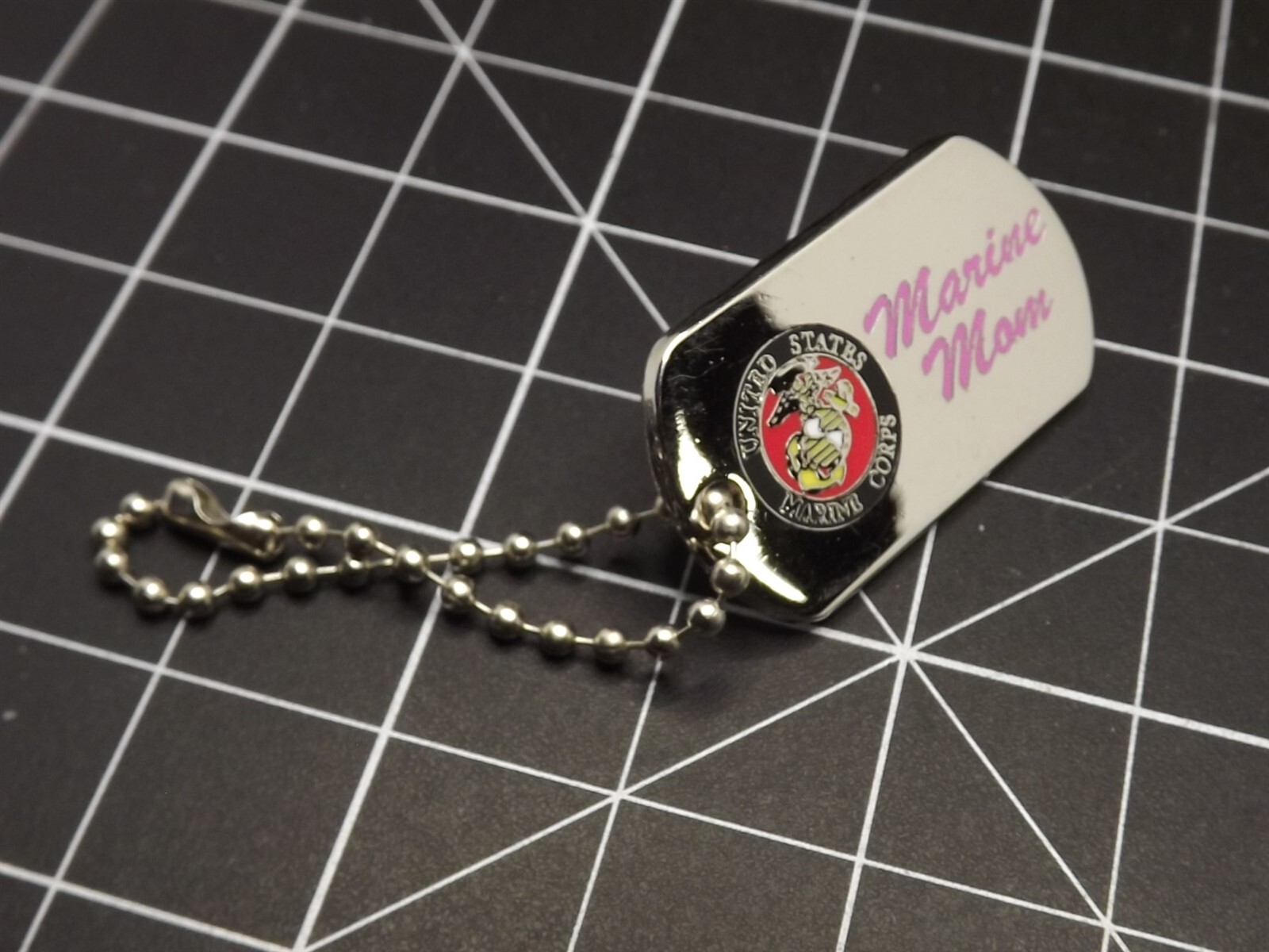 s l1600 1071.jpg "Marine Mom" Chrome Dog Tag Lapel Pin – 1-1/4" Chrome with Pink Script & Enamel USMC Emblem, Bead Chain – view 2