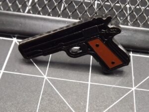 .38 / 1911-Style Pistol Lapel Pin – Black enamel