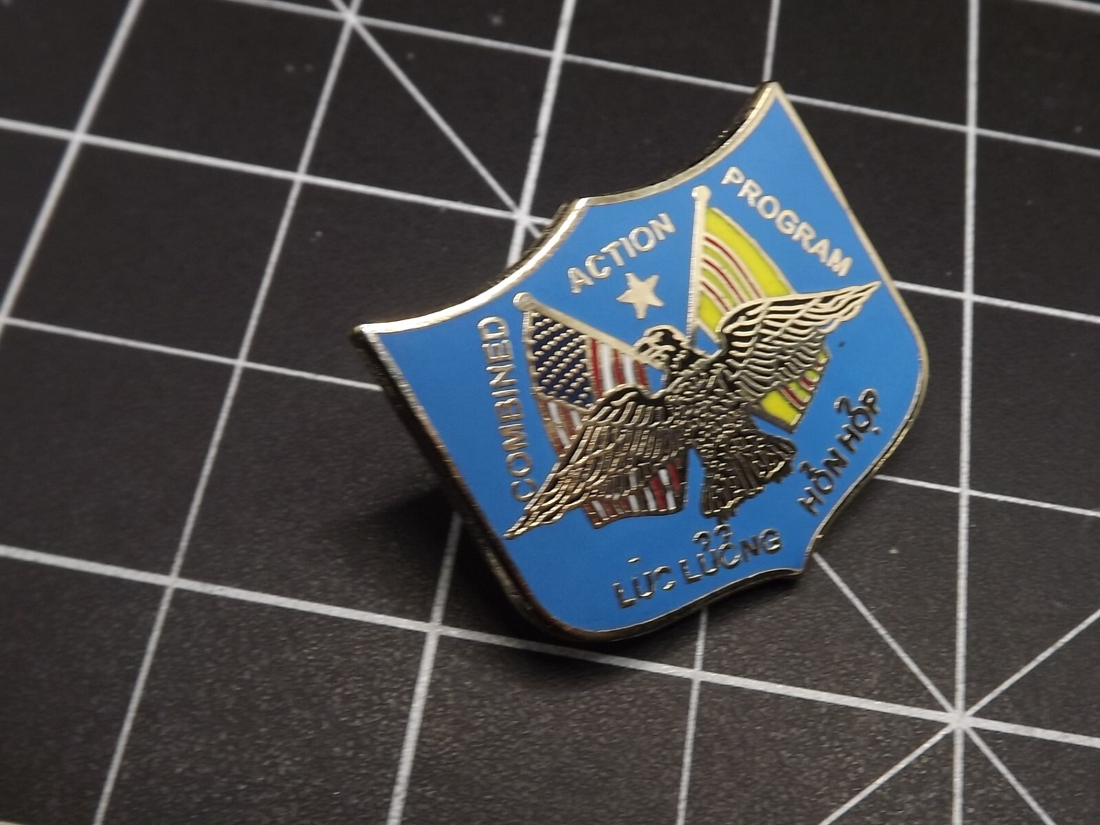 s l1600 5132.jpg USMC Vietnam Combined Action Program Lapel Pin – Enamel CAP Shield with Eagle & Flags Hat Pin – view 2