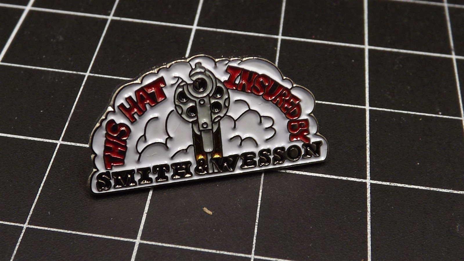 s l1600 7065.jpg “This Hat Insured by Smith & Wesson” Lapel Pin – photo 2